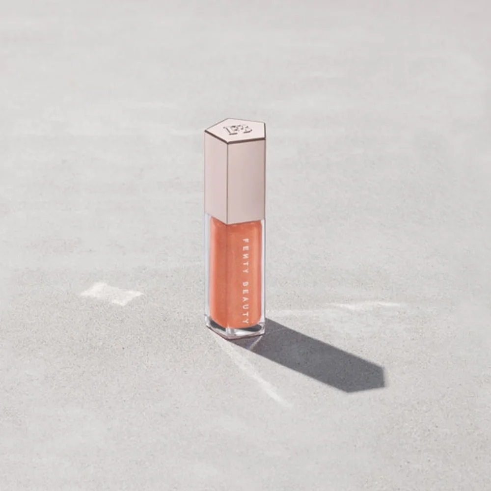 Fenty Beauty Gloss Bomb in Shimmering Gold Pearl Champ Stamp Fantasy
